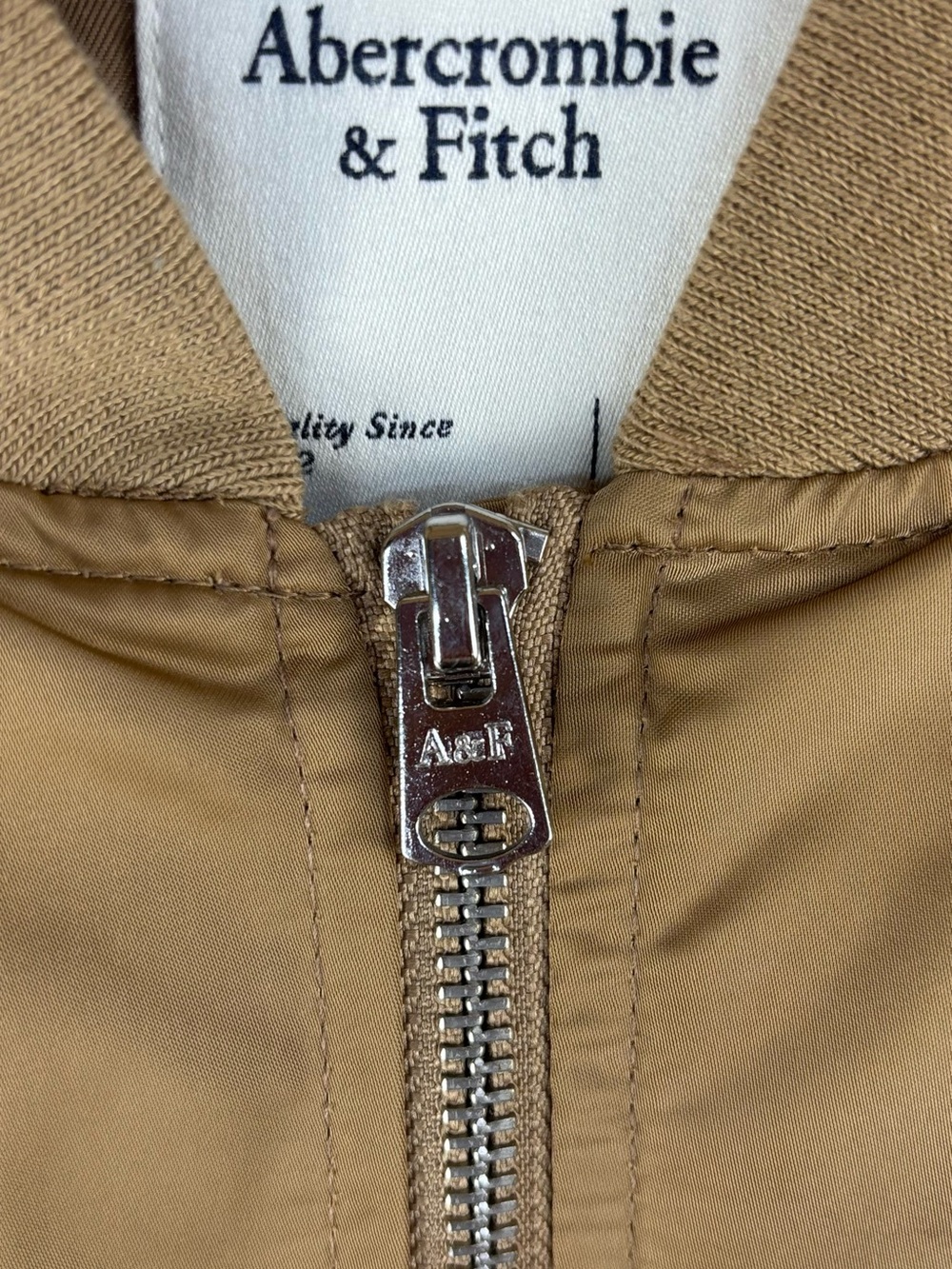 Abercrombie & Fitch Woman’s shiny tan/gold wind and water resistant puffer coat